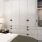 a bedroom with a large storage system
