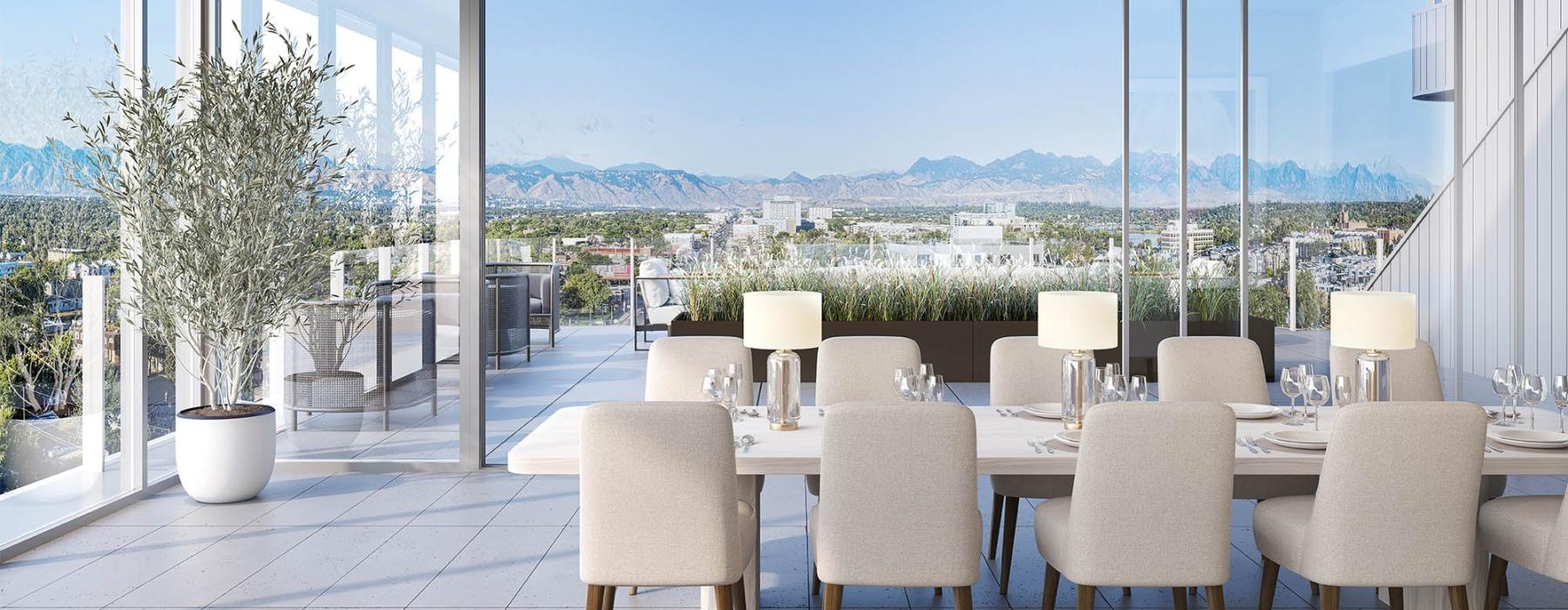 a table with chairs and a view of the city